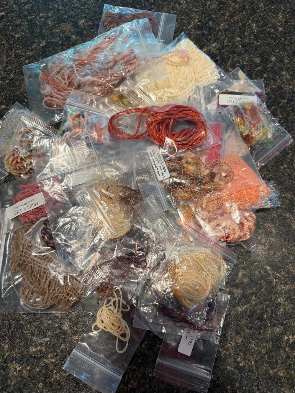 45 Assorted yellow, orange a d rust  fiber trim packages